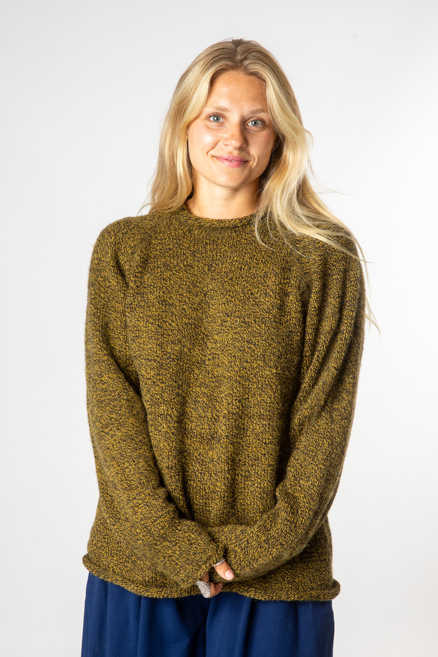 Sophie is wearing size S roll neck alpaca sweater in bumblebee