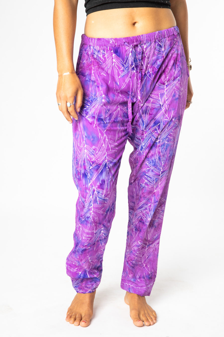 Sophie is wearing size S/M batik lounge pants in violet bamboo leaves