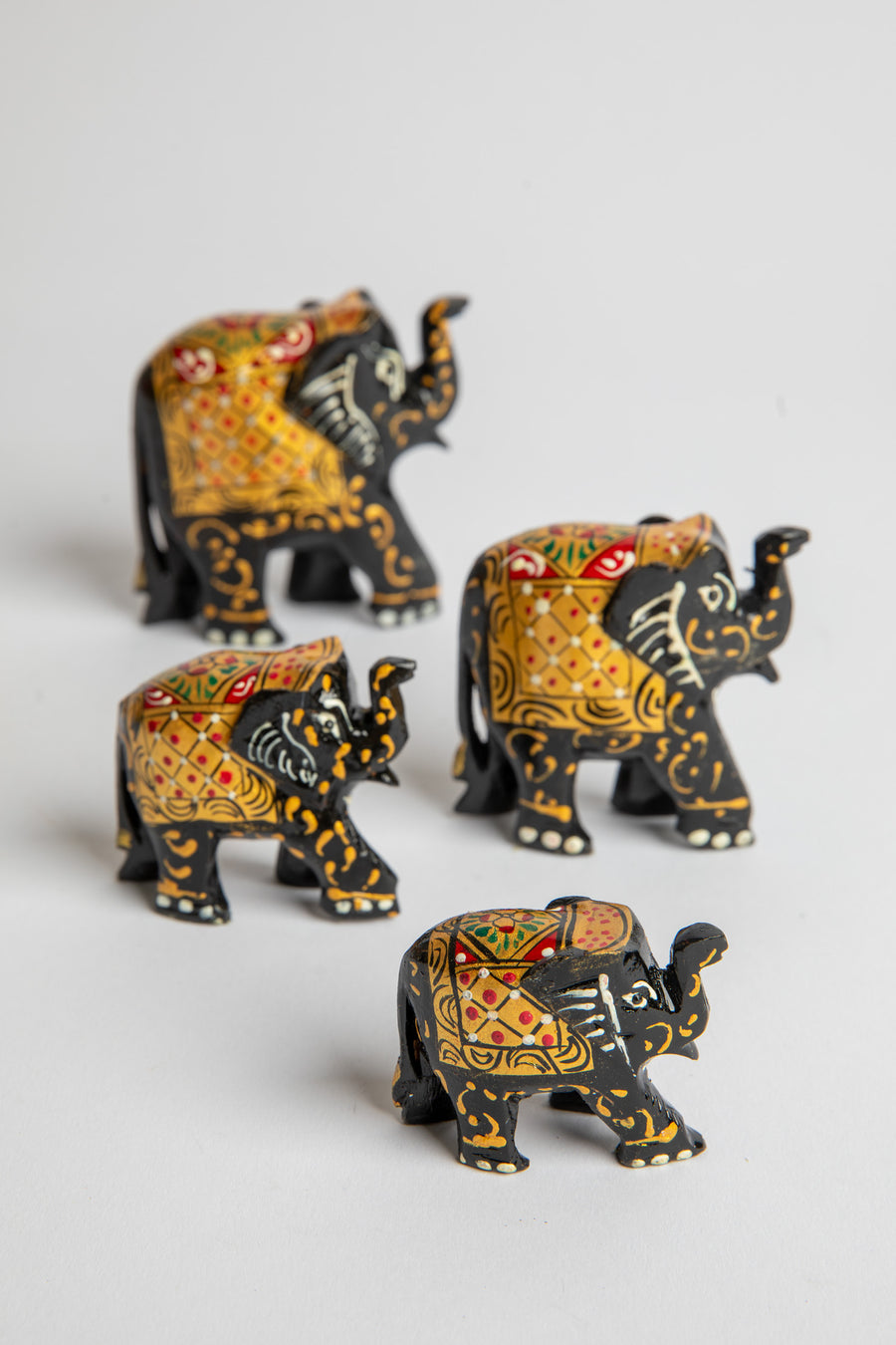 Wooden hand painted elephant family in black
