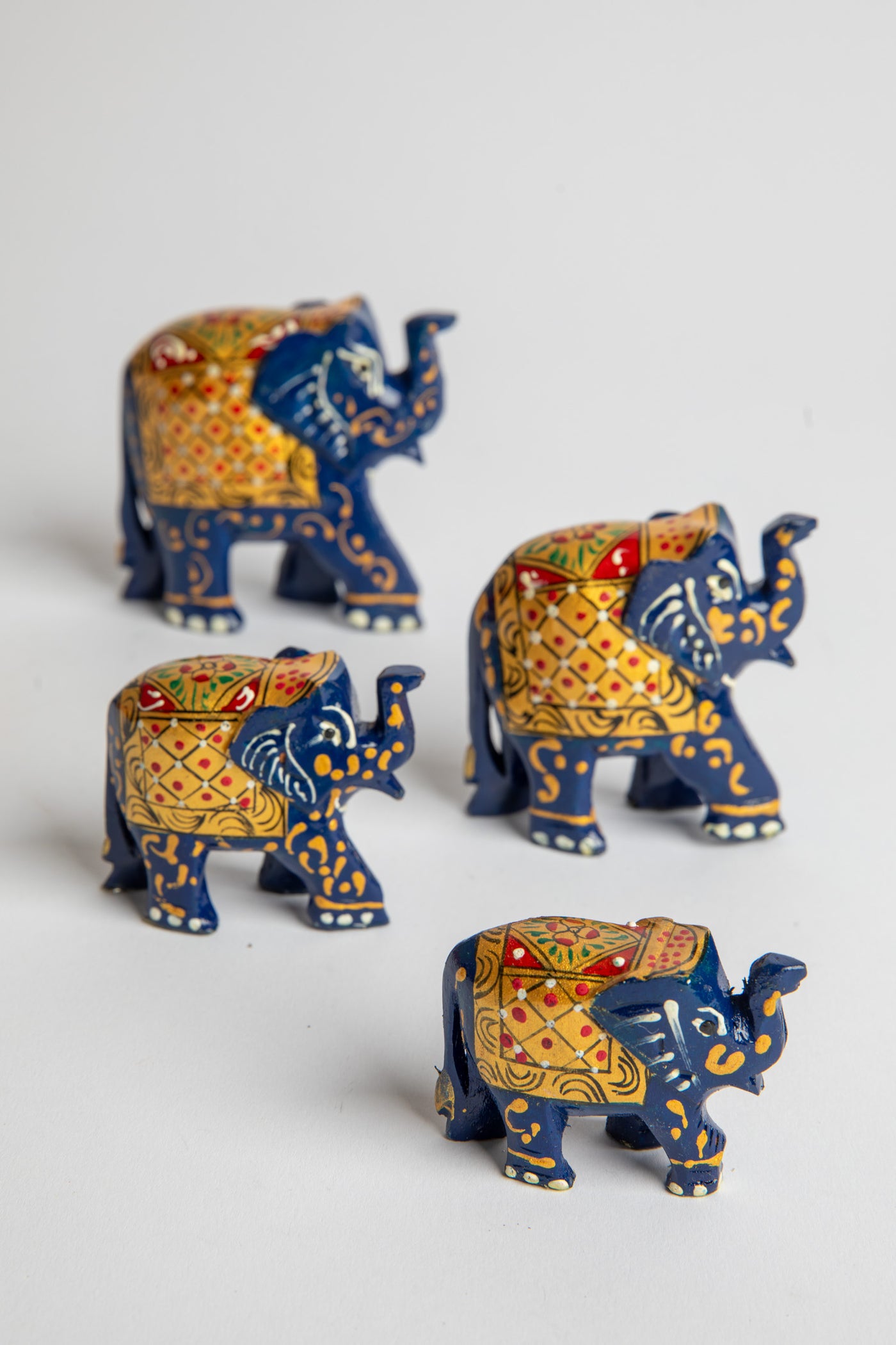 Wooden hand painted elephant family in blue