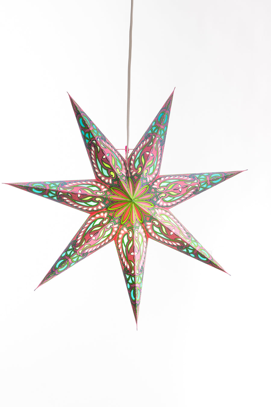 A pink and green paper lantern in the shape of a 7-point star in front of a white backdrop. 