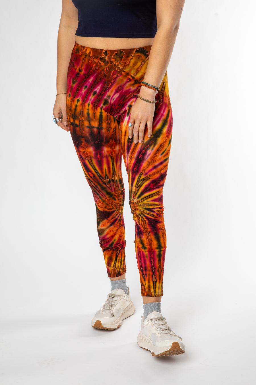 Sophie is wearing size S/M tie dye leggings in sunset