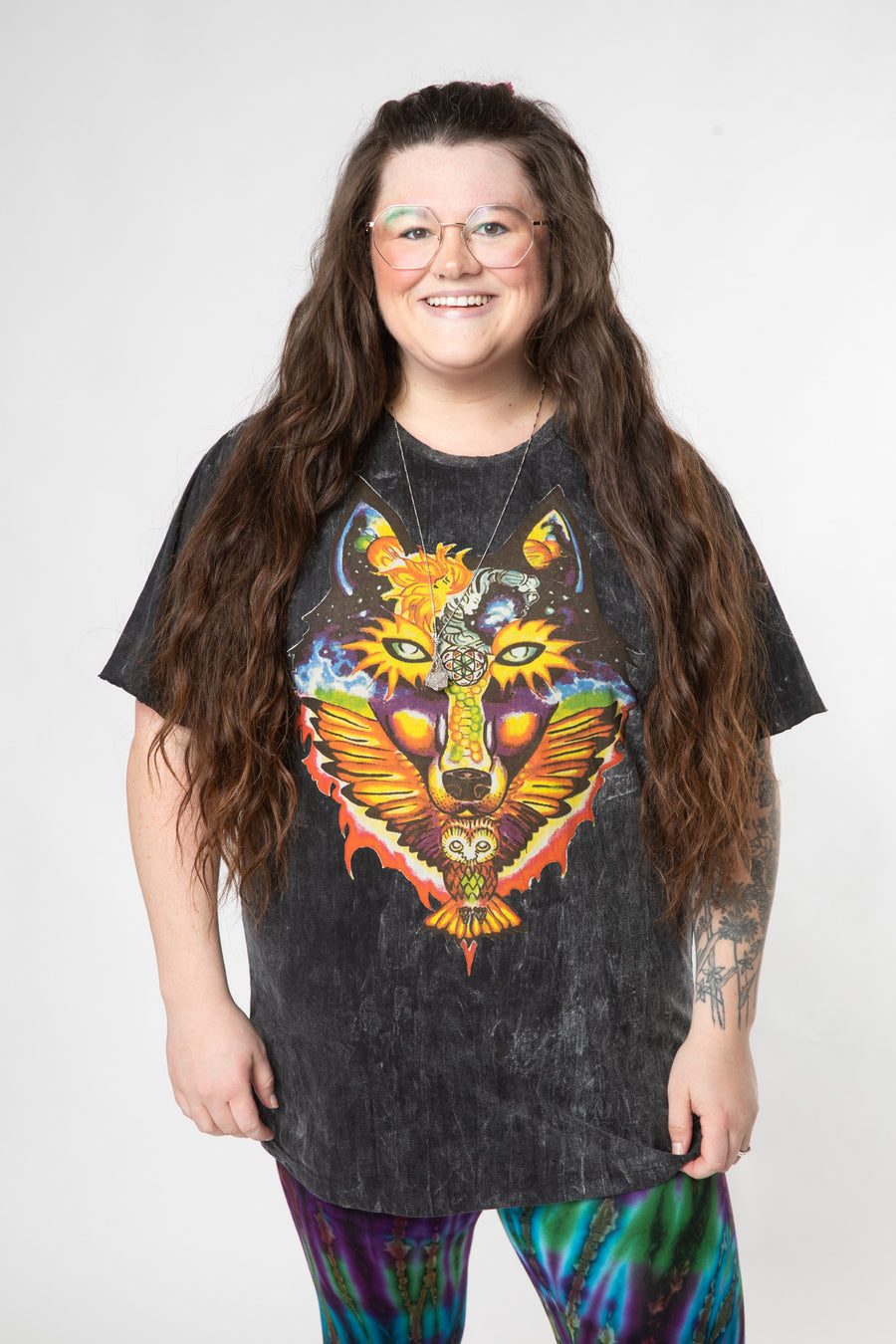 Desiree is wearing size L cosmic t shirt in black 