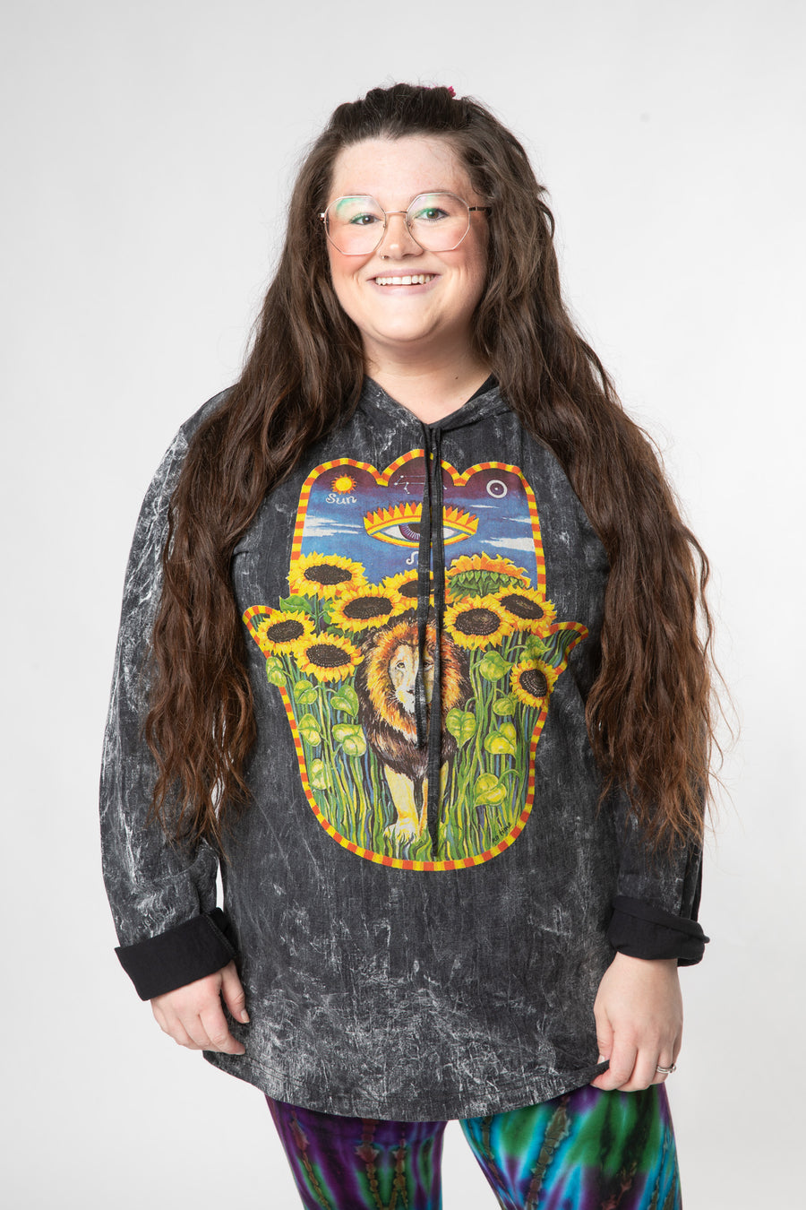 Desiree is wearing size L black hamsa lightweight hoodie