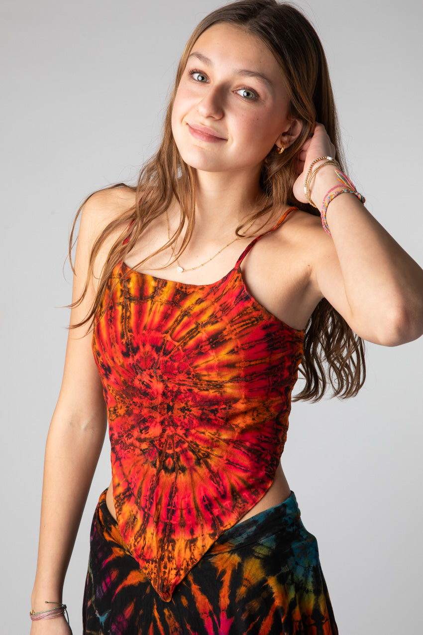 Ember is wearing a tie dye handkerchief top in sunset