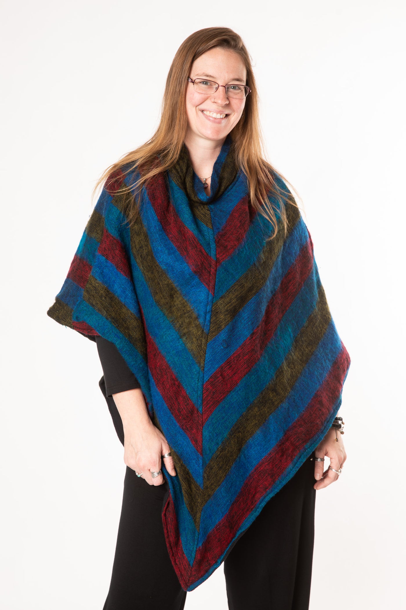 Margaret is wearing a fleece lined poncho in multicolor