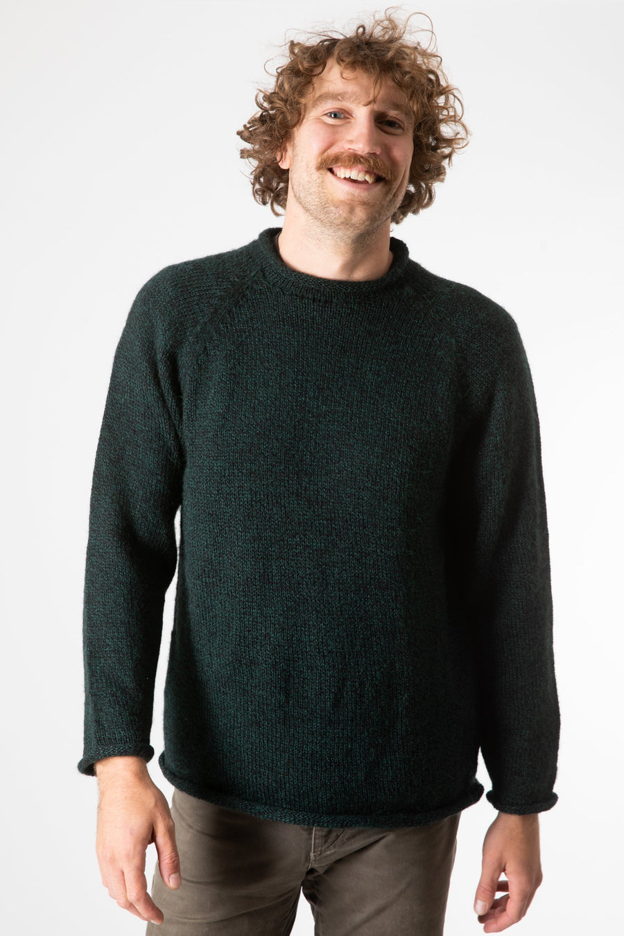 Ryan is wearing size XL roll neck alpaca sweater in forest